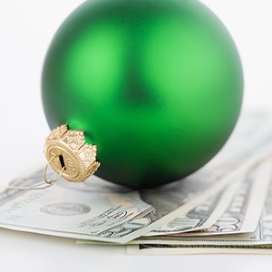 Image: Ornament and money (© Tetra Images/Corbis)